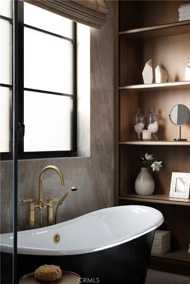 Primary bath with Waterworks burnished brass fixtures, handcrafted tiles, and TOTO washlet. - 615 Lido Park, Newport Beach CA 92663 - photo 12