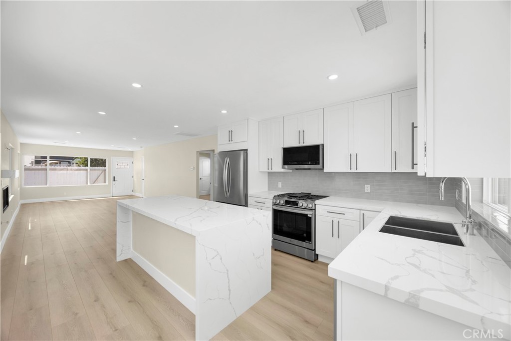 Kitchen is open to large living room - 806 W Balboa Boulevard Front, Newport Beach CA 92661 - photo 16