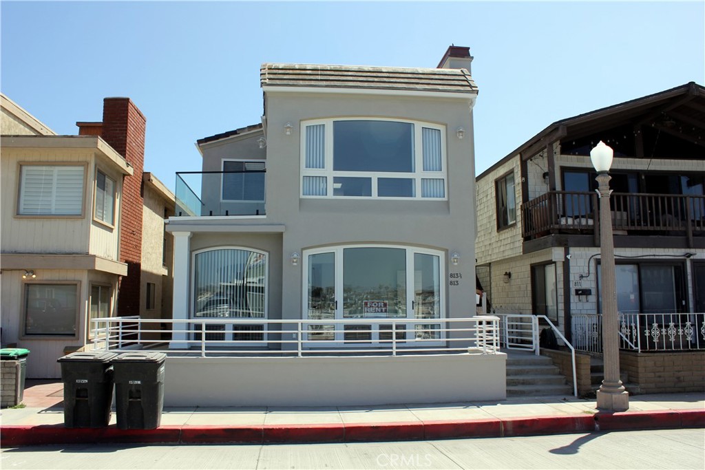 Front view of home. Unit 1 is downstairs. - 813 E Bay Avenue 1, Newport Beach CA 92661 - photo 1
