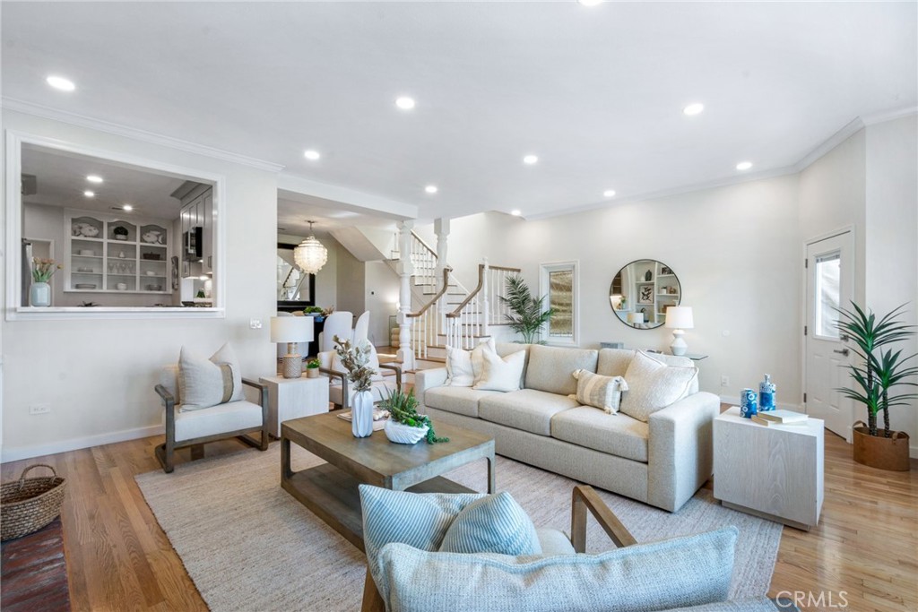 Spacious living room with high ceilings, open to kitchen and dining room - 920 E Oceanfront, Newport Beach CA 92661 - photo 5