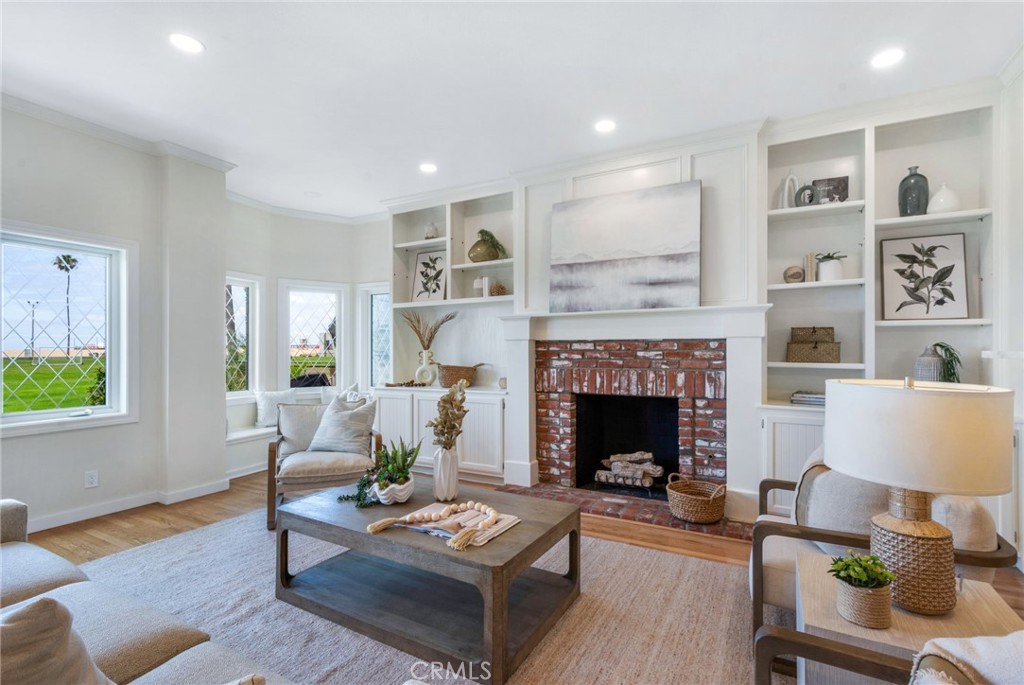 Beautiful brick gas fireplace in living room - 920 E Oceanfront, Newport Beach CA 92661 - photo 7