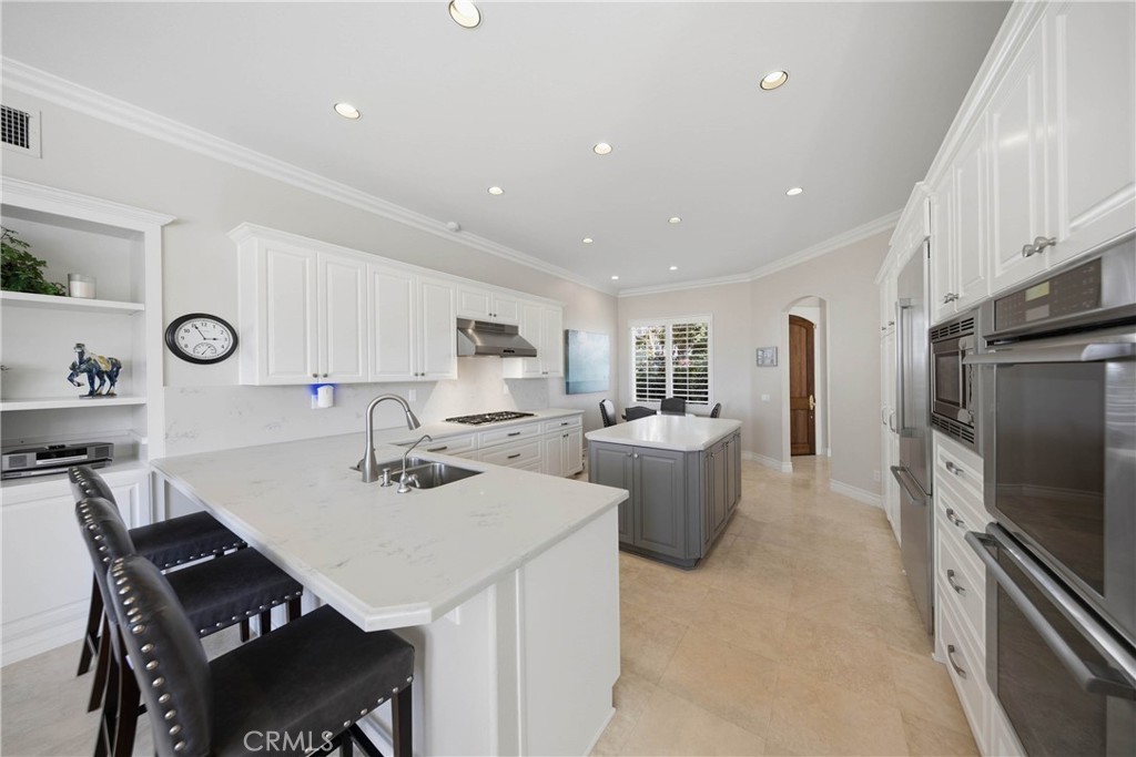 Newley Updated Kitchen - with Relocated stovetop to Exterior wall from Center Island for Better Utility - 21 Pavona, Newport Coast CA 92657 - photo 8
