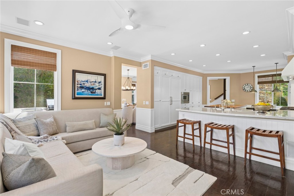 Family room opening to breakfast bar and kitchen area. - 25 Lyon, Newport Coast CA 92657 - photo 4
