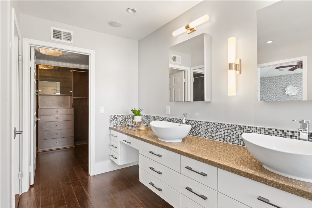 Primary Bedroom with vanity and dual sinks - 4 Chandon, Newport Coast CA 92657 - photo 25