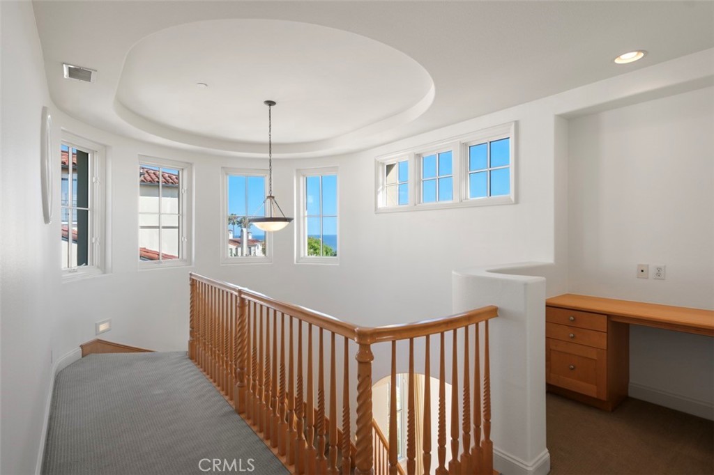 Stair landing with small desk area - 76 Sidra Cove, Newport Coast CA 92657 - photo 25