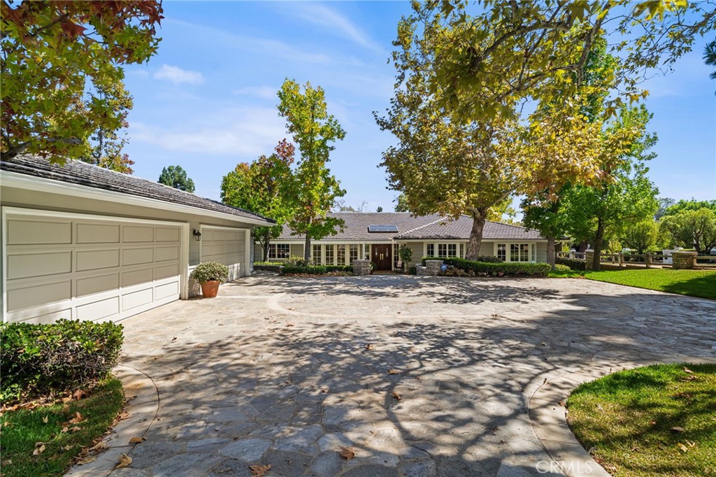 4 car garage with ample parking for guests - 10982 Bent Tree Road, North Tustin CA 92705 - photo 3