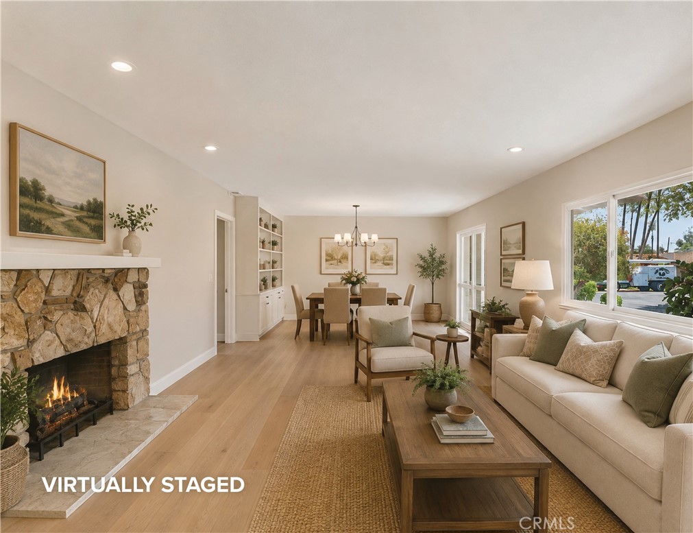 An inviting living room and dining room, spacious and comfortable. Digitally enhanced. - 1321 El Finito Way, North Tustin CA 92705 - photo 13