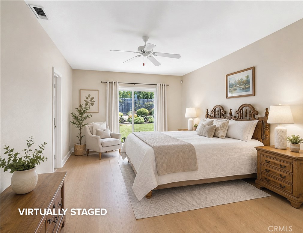 Primary bedroom with sliders out to the yard. Digitally enhanced. - 1321 El Finito Way, North Tustin CA 92705 - photo 21