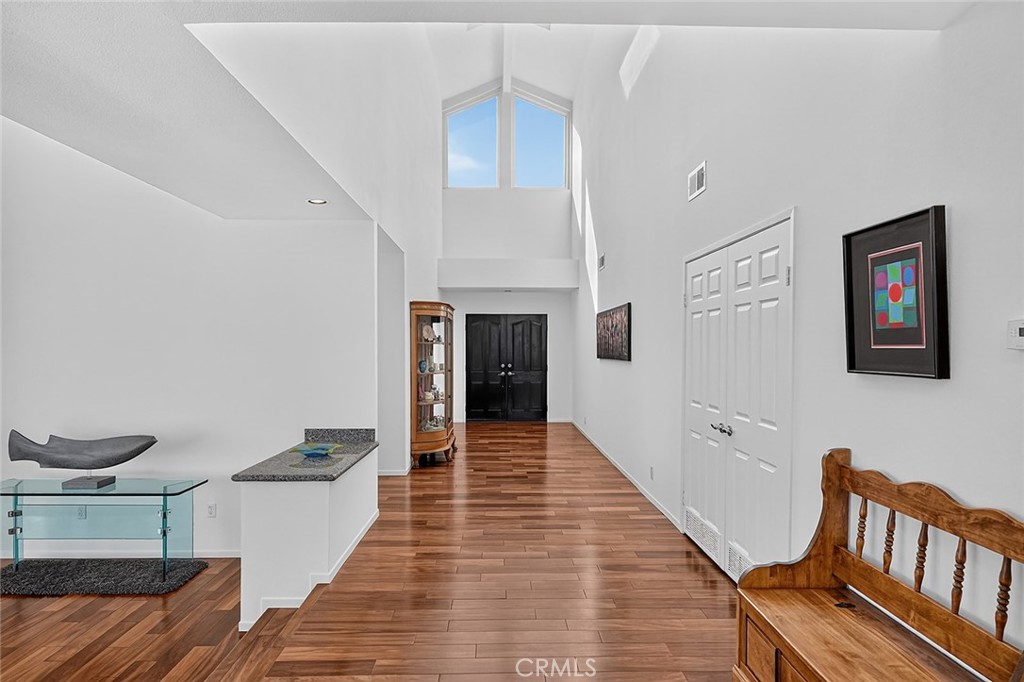 Brazilian Tiger mahogany flooring runs throughout the home - 10571 Morada, Orange CA 92869 - photo 9