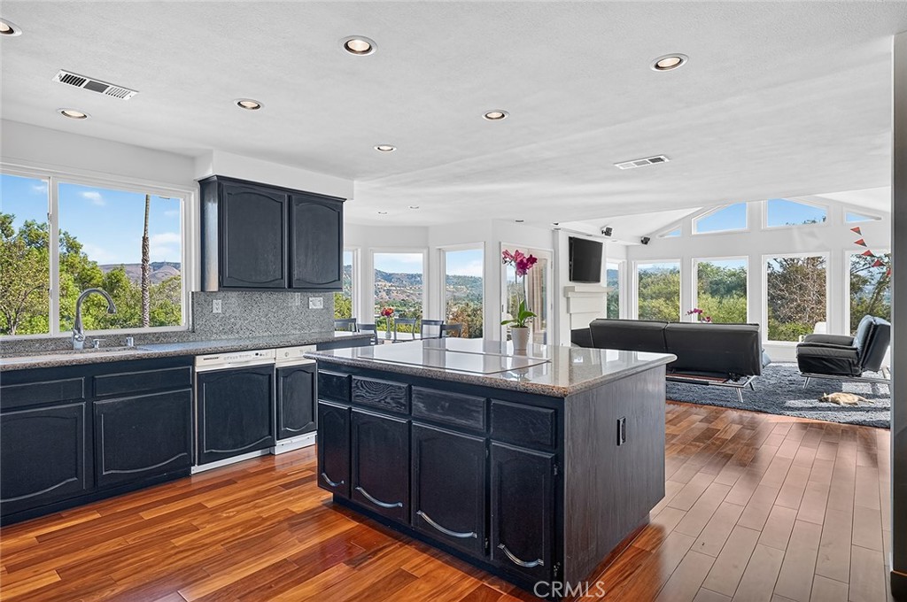 The kitchen is open to the family room and also enjoys the amazing views - 10571 Morada, Orange CA 92869 - photo 17