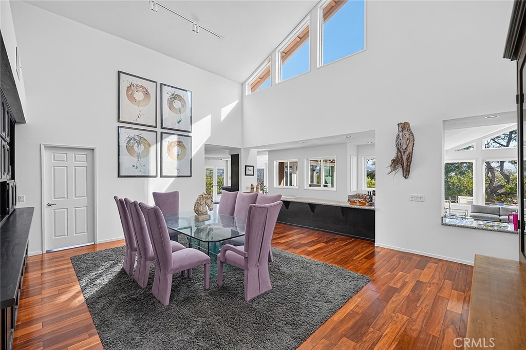 The dining room has soaring ceilings with high windows bringing in the natural lighting - 10571 Morada, Orange CA 92869 - photo 25