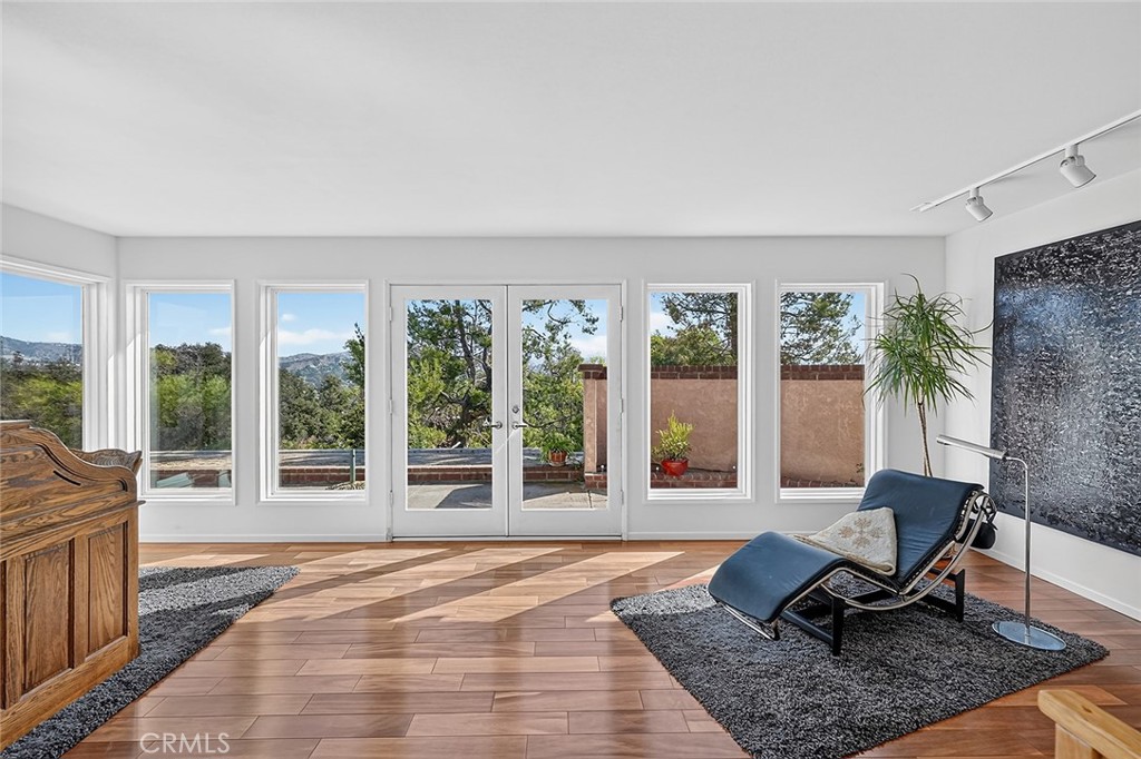 In the primary there's plenty of space for a reading nook or a desk and French doors to the patio - 10571 Morada, Orange CA 92869 - photo 32