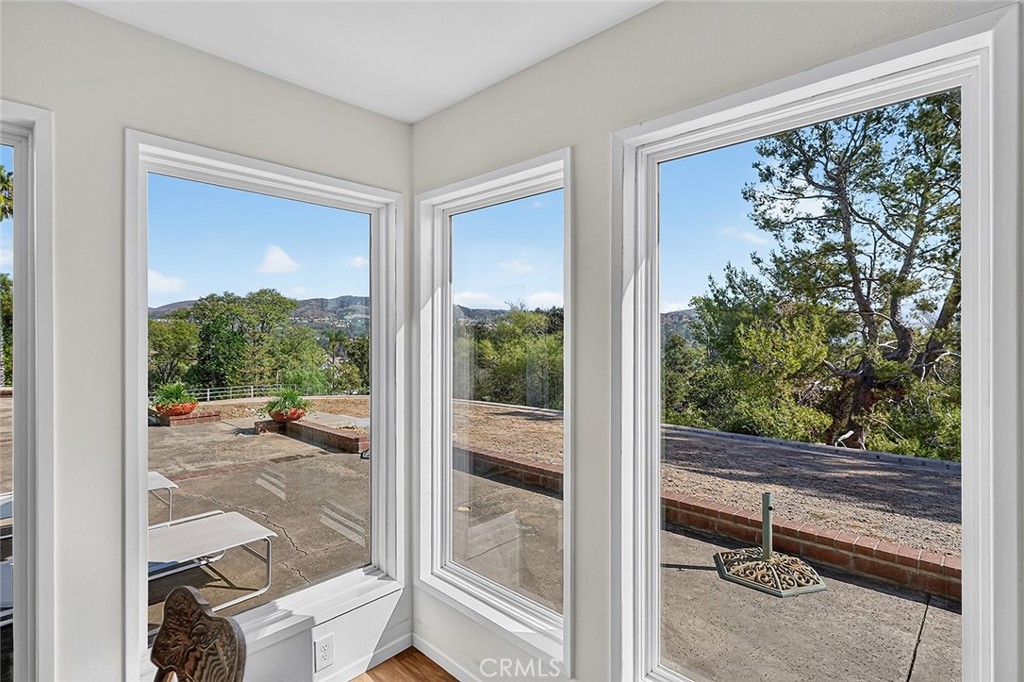Corner windows in the primary bedroom offer panoramic views - 10571 Morada, Orange CA 92869 - photo 33