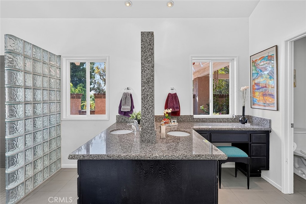 Dual vanities and a private water closet - 10571 Morada, Orange CA 92869 - photo 36