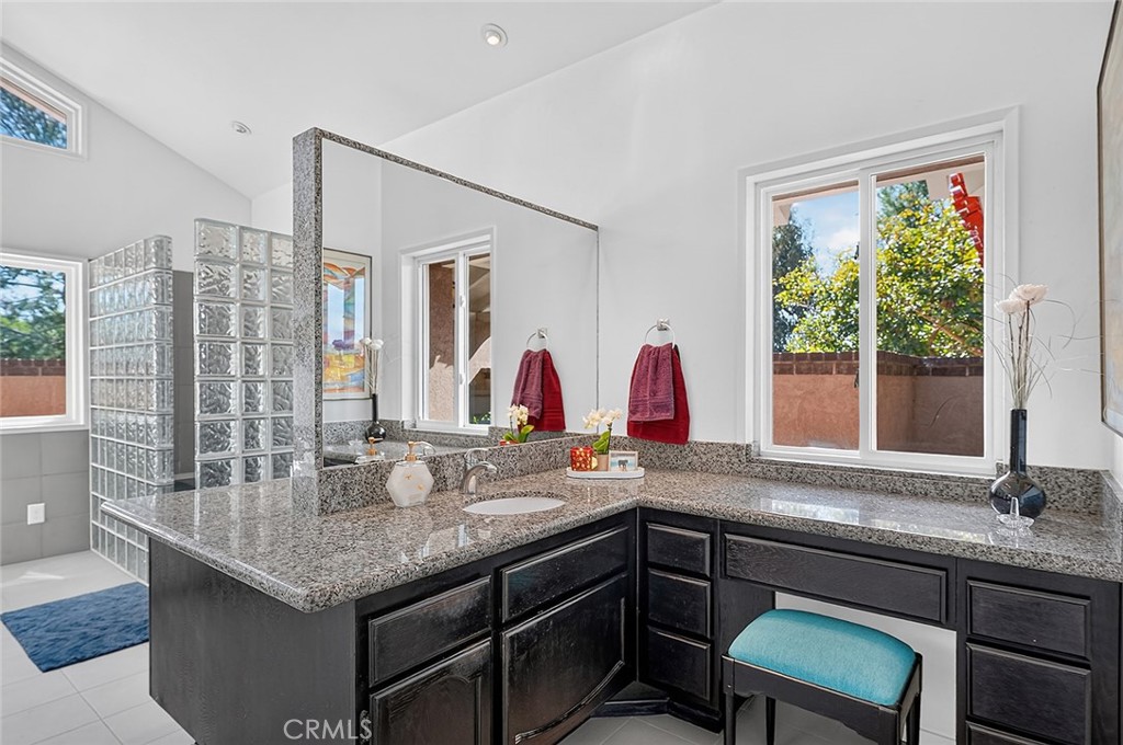 The large walk in closet is located adjacent to the bath - 10571 Morada, Orange CA 92869 - photo 38