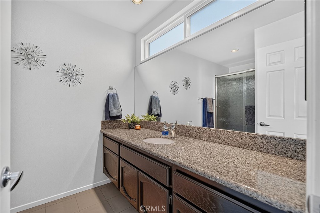 The private bath attached to the second bedroom is spacious - 10571 Morada, Orange CA 92869 - photo 42