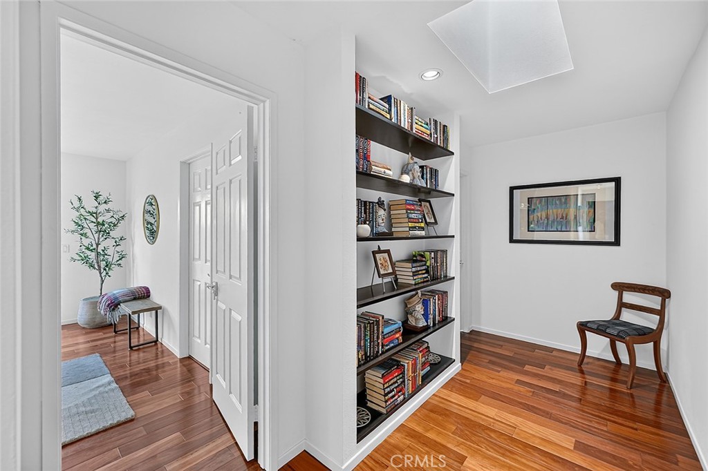 The hallway with built in bookcase and a skylight - 10571 Morada, Orange CA 92869 - photo 45