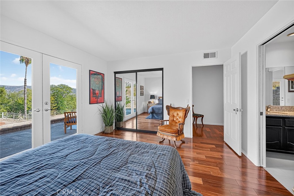 The fourth bedroom has access to the side patio and a view towards the arena - 10571 Morada, Orange CA 92869 - photo 51
