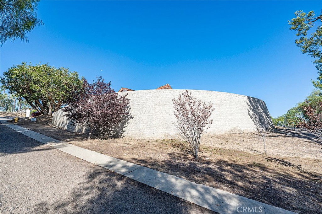 As you drive up Hi Top Lane to the private driveway for your 3 car garage you'll see the impressive retaining wall - 10571 Morada, Orange CA 92869 - photo 66