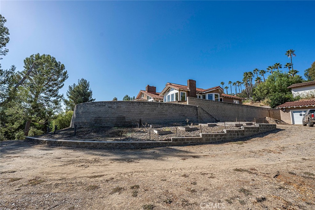There is a network of retaining walls that created a level and useable lot - 10571 Morada, Orange CA 92869 - photo 67