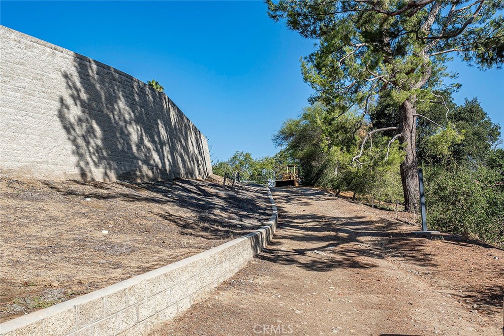 This road leads around to the double garage next to the horse stalls and arena - 10571 Morada, Orange CA 92869 - photo 68