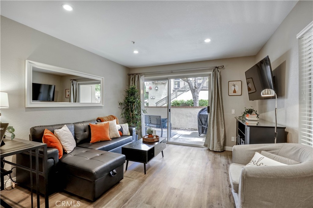 Living Room with Sectional Sofa, SmartTV and open floor plan - 129 N Cross Creek, Orange CA 92869 - photo 2