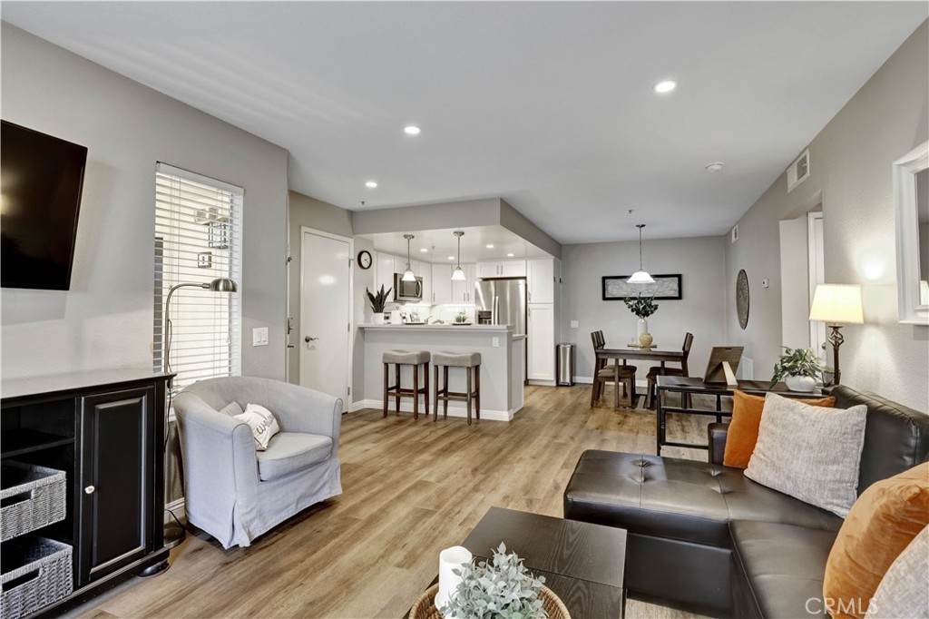 Living Room with Sectional Sofa, SmartTV and open floor plan - 129 N Cross Creek, Orange CA 92869 - photo 5