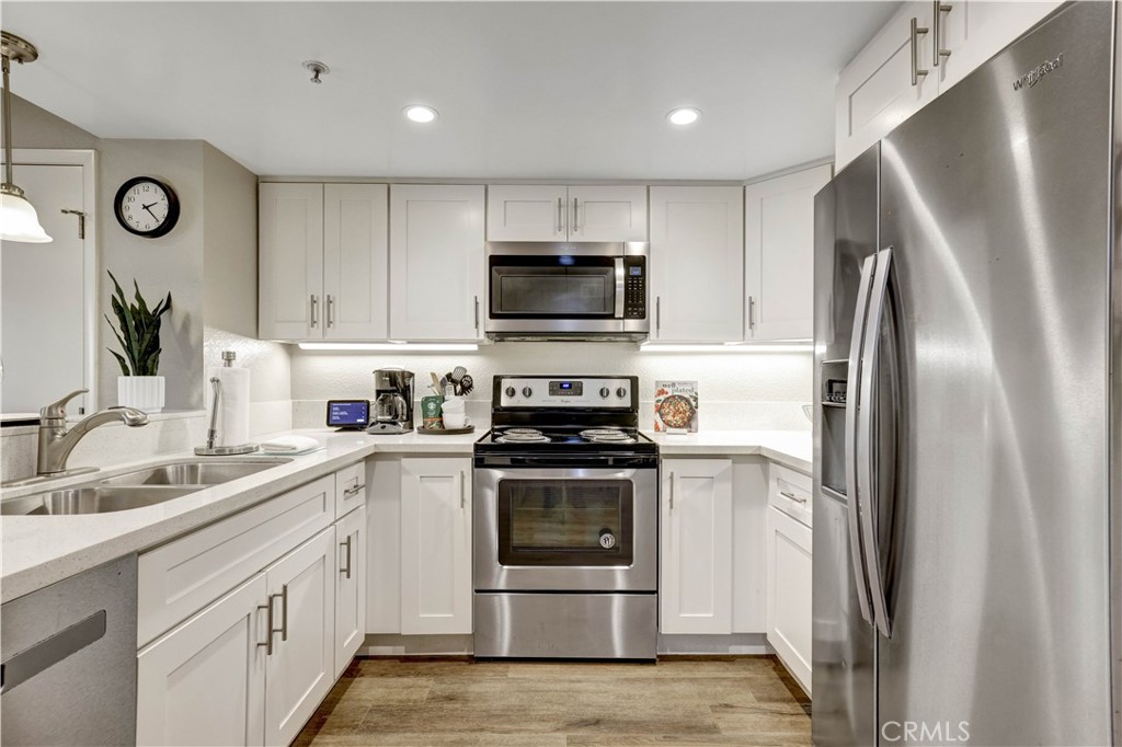Full Kitchen with Stainless Steel appliances and Kitchenware - 129 N Cross Creek, Orange CA 92869 - photo 9