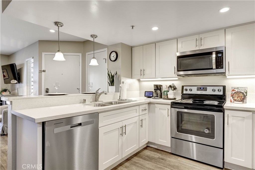 Full Kitchen with Stainless Steel appliances and Kitchenware - 129 N Cross Creek, Orange CA 92869 - photo 10