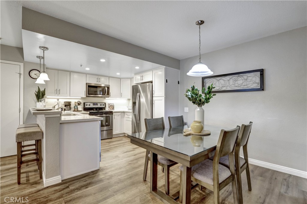 Full Kitchen with Stainless Steel appliances and Kitchenware - 129 N Cross Creek, Orange CA 92869 - photo 14
