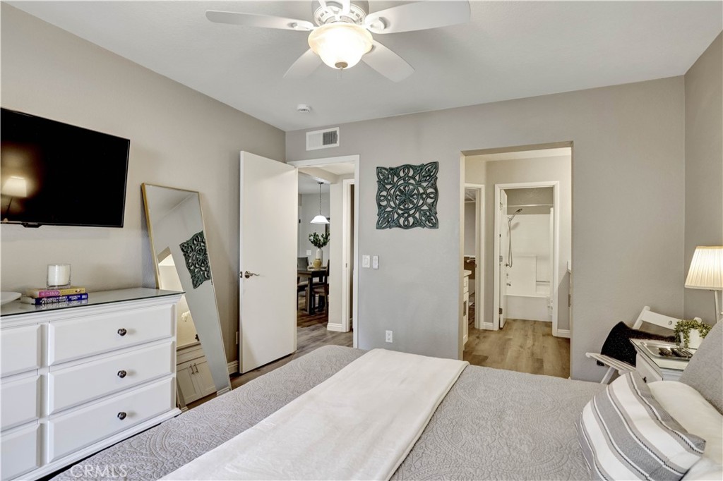Primary Suite with view to private patio and Smart TV, en suite full Bathroom - 129 N Cross Creek, Orange CA 92869 - photo 24