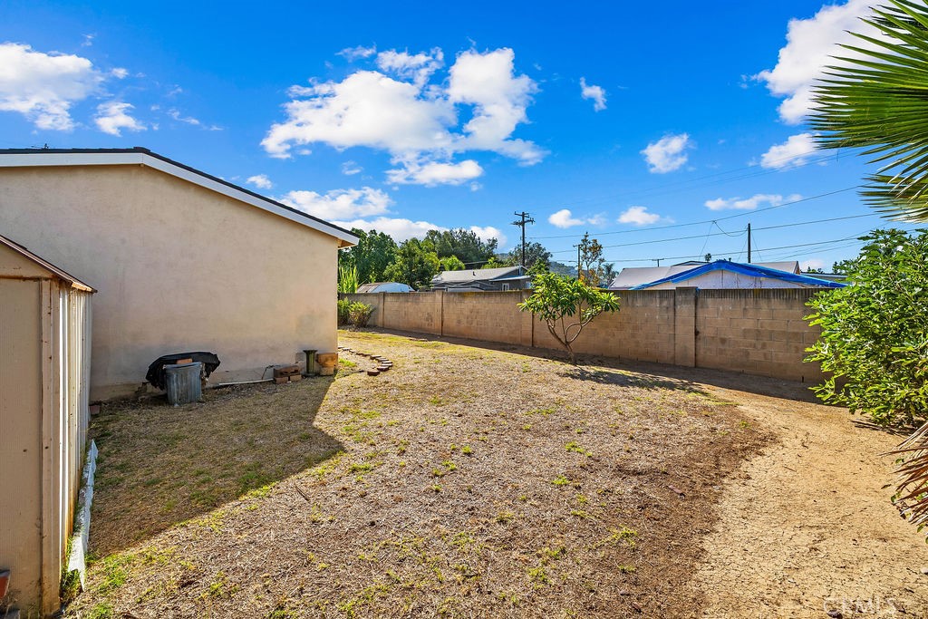 Additional view of the backyard showcasing the usable outdoor space behind the home. - 150 S Park, Orange CA 92869 - photo 7