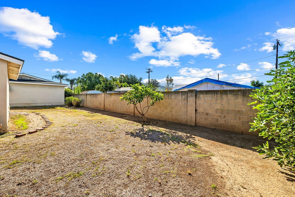 Another look at the backyard and open outdoor area, offering plenty of possibilities for a future owner. - 150 S Park, Orange CA 92869 - photo 8