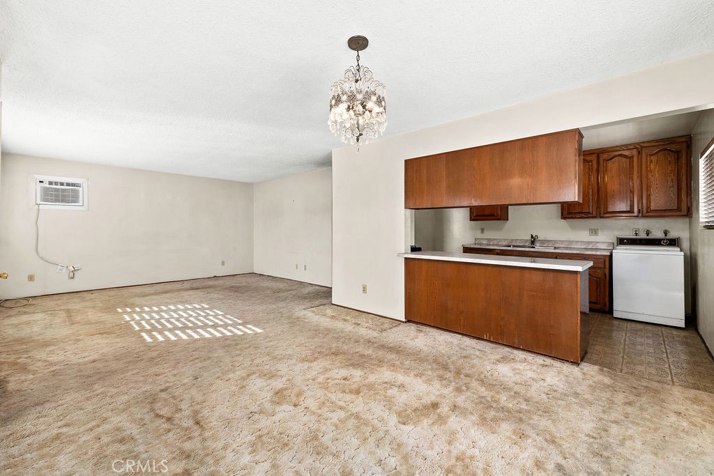 Spacious main living area offers plenty of flexibility for both living and dining furniture. - 150 S Park, Orange CA 92869 - photo 14
