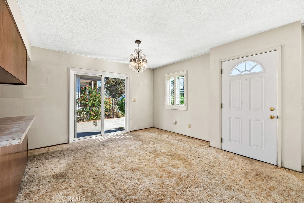 Dining area near the front entry features natural light and convenient access to the kitchen and living room. - 150 S Park, Orange CA 92869 - photo 16