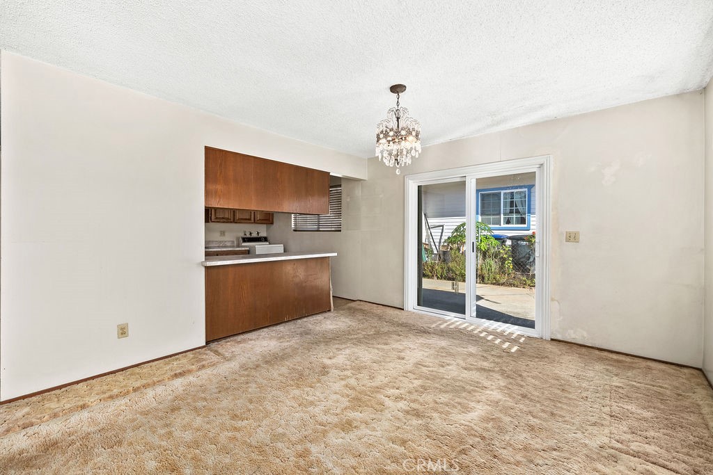 Dining space sits adjacent to the kitchen and features sliding glass doors providing additional natural light. - 150 S Park, Orange CA 92869 - photo 17