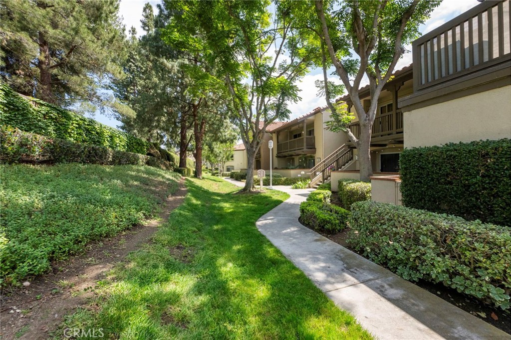 Peaceful setting with mature trees and greeery. - 215 S Cross Creek L, Orange CA 92869 - photo 1