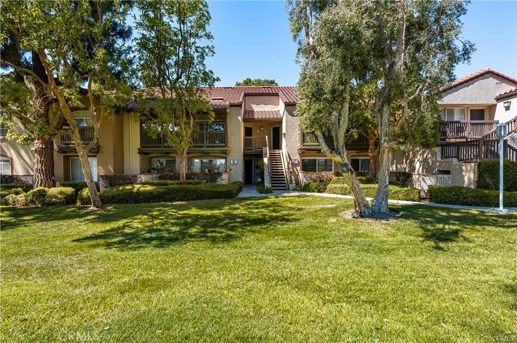 Unit overlooks huge grassy area. - 236 S Grisly Canyon Drive M, Orange CA 92869 - photo 1