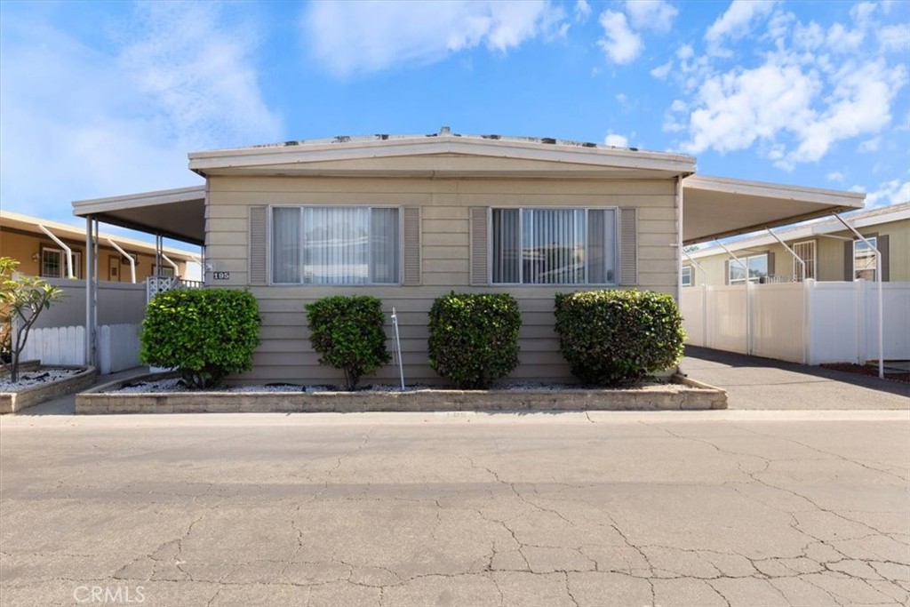 Front Exterior and Covered Parking - 300 N Rampart 195, Orange CA 92868 - photo 2