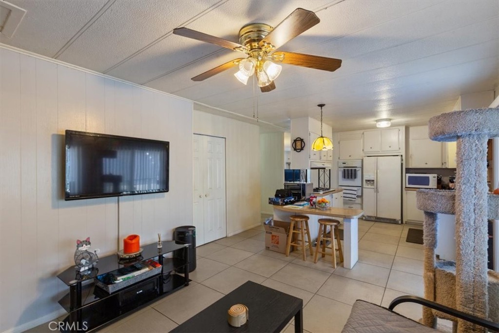 Spacious Living Room and Kitchen View - 300 N Rampart 195, Orange CA 92868 - photo 8