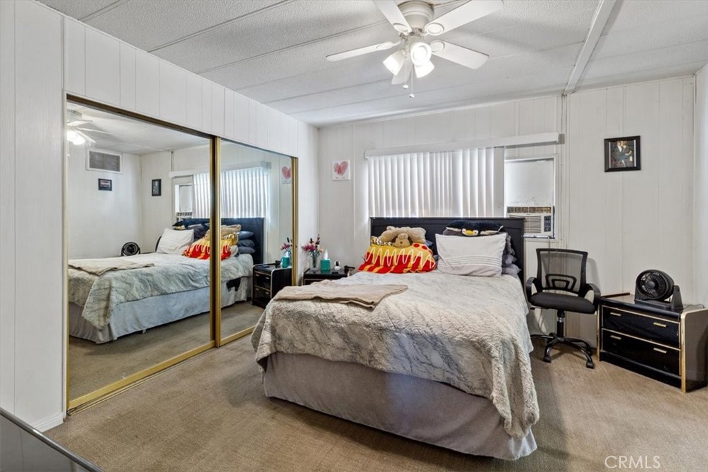 Primary Bedroom with Mirrored Closet Doors - 300 N Rampart 195, Orange CA 92868 - photo 12
