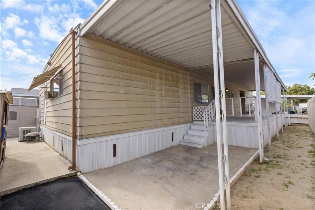 Exterior Side View and Covered Parking - 300 N Rampart 195, Orange CA 92868 - photo 22