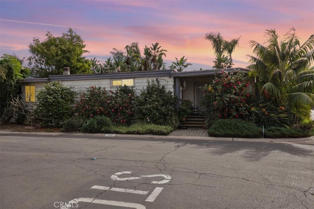 Corner lot with lush tropical plants - 300 N Rampart St 158, Orange CA 92868 - photo 1