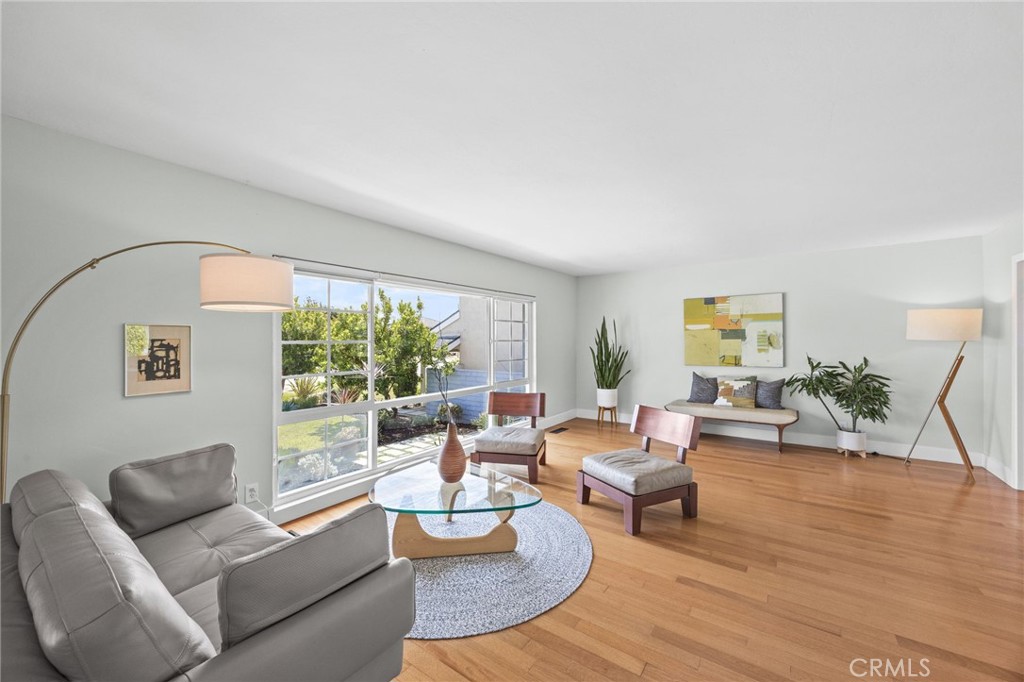 Hardwood floors and dual-pane picture windows make this a beautiful living space - 328 S Violet Lane S, Orange CA 92869 - photo 1