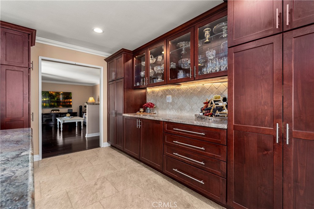 Buffet bar with kitchen rollouts, and custom cabinetry. Lots of storage space. - 390 N Milford Road, Orange CA 92867 - photo 18
