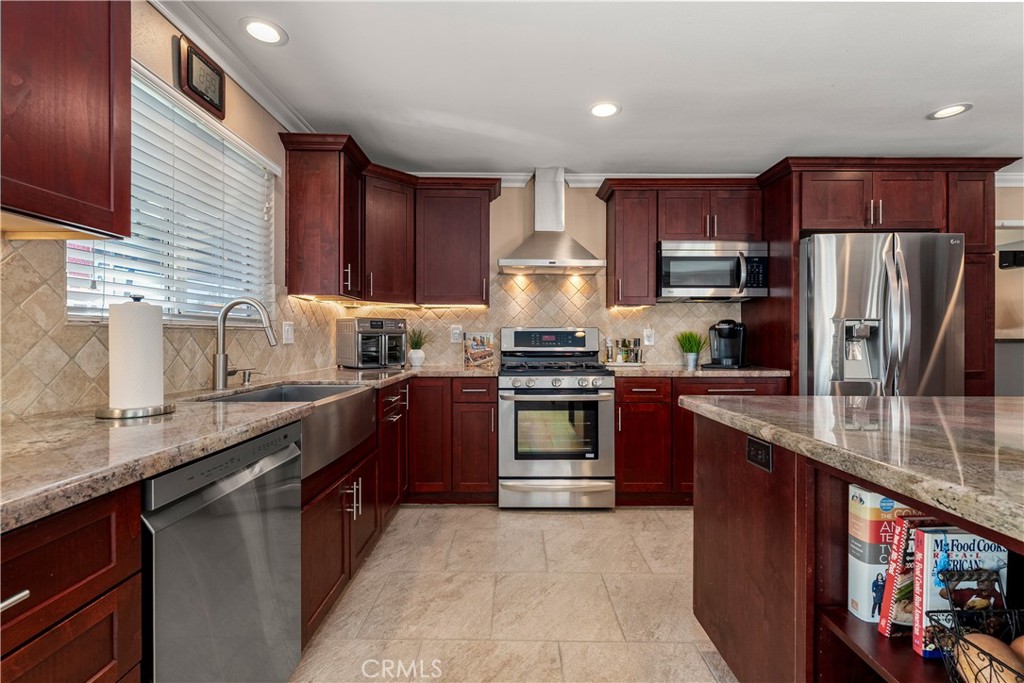 Tile floors, granite countertops, tile backsplash, you name it this kitchen has it! - 390 N Milford Road, Orange CA 92867 - photo 19