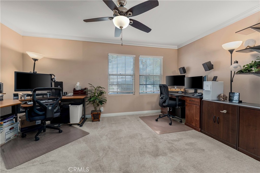 Downstairs large bedroom, being used as an office at its current status. - 390 N Milford Road, Orange CA 92867 - photo 26
