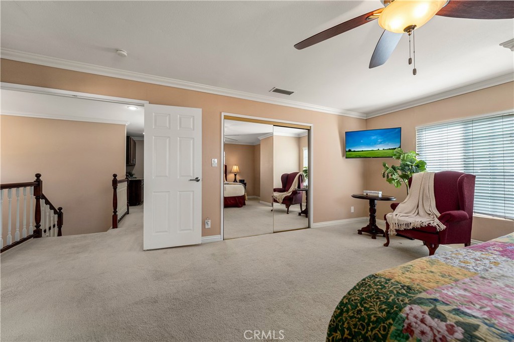 Upstairs primary bedroom with double door entry. - 390 N Milford Road, Orange CA 92867 - photo 31