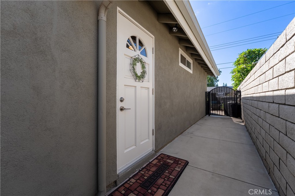 Separate ADU entrance from side of house. This allows, any occupant to not have to come through the main home. - 390 N Milford Road, Orange CA 92867 - photo 41