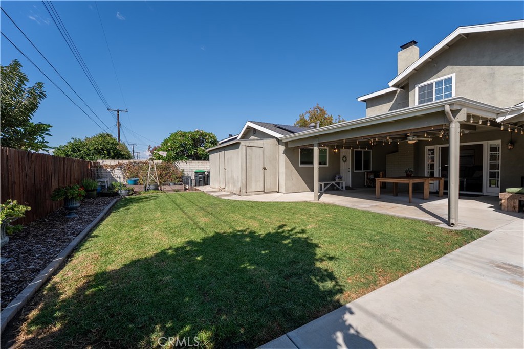 Here's a shot of the grass and garden area and a nice storage shed for all those storage needs. - 390 N Milford Road, Orange CA 92867 - photo 53